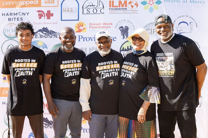 One man wearing Humanitarian Day t-shirt organizing food distribution