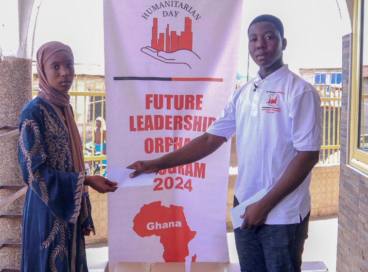 Two people standing in front of a banner that says future leadership