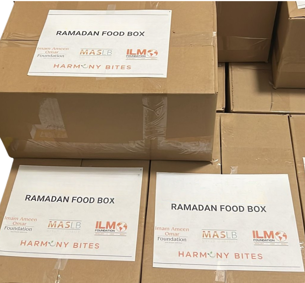 Several boxes of ramadan food are stacked on top of each other