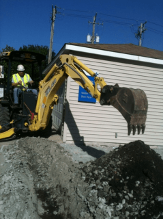 Man digging with an excavator