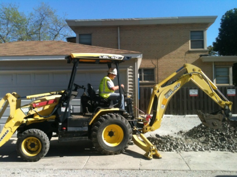 Man digging with an excavator