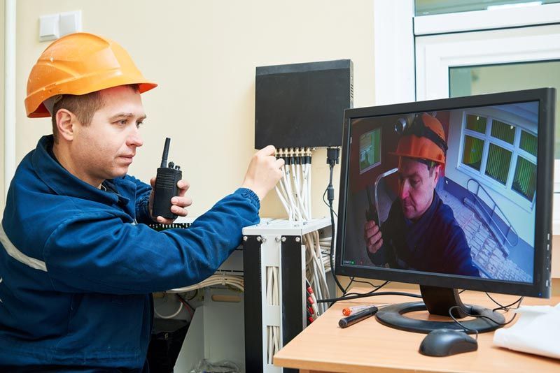 Skilled Worker Setting Up Security Access Control — Cambush Security Solutions NT in Coconut Grove, NT