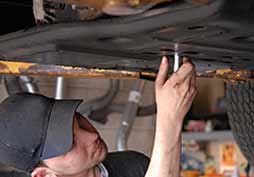 Man Fixing Car — United Middleboro Petroleum Inc in Middleboro, MA