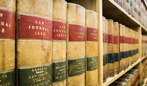Stacks Of Antique Law Books — Real Estate Attorneys in Huntingdon, PA