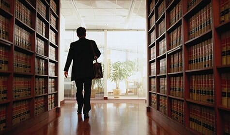 Lawyer Exiting A Law Library — Real Estate Attorneys in Huntingdon, PA