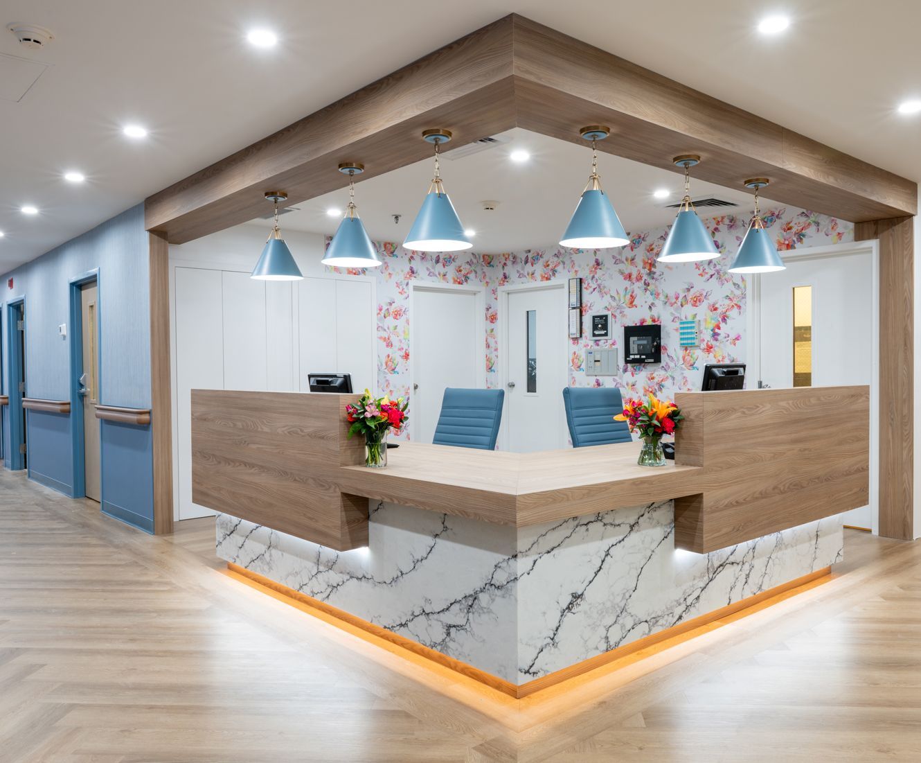 There is a reception desk in the middle of the room.