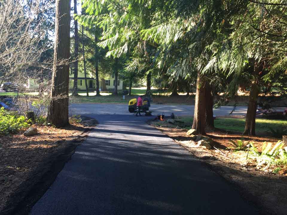 Man Operating Road Equipment – Acme Paving & Seal Coating, Inc. – Kent, WA