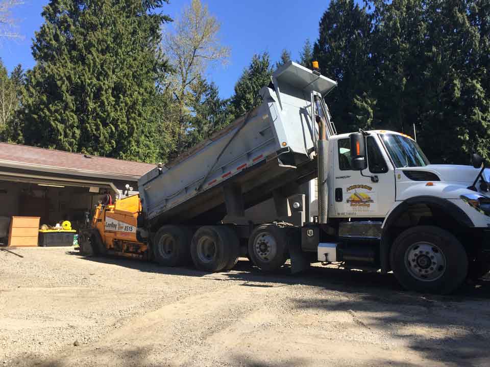 Truck Loading A Paver – Acme Paving & Seal Coating, Inc. – Kent, WA