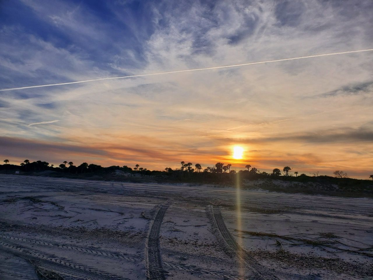 tire tracks on the beach - across the street from beach 5 villas