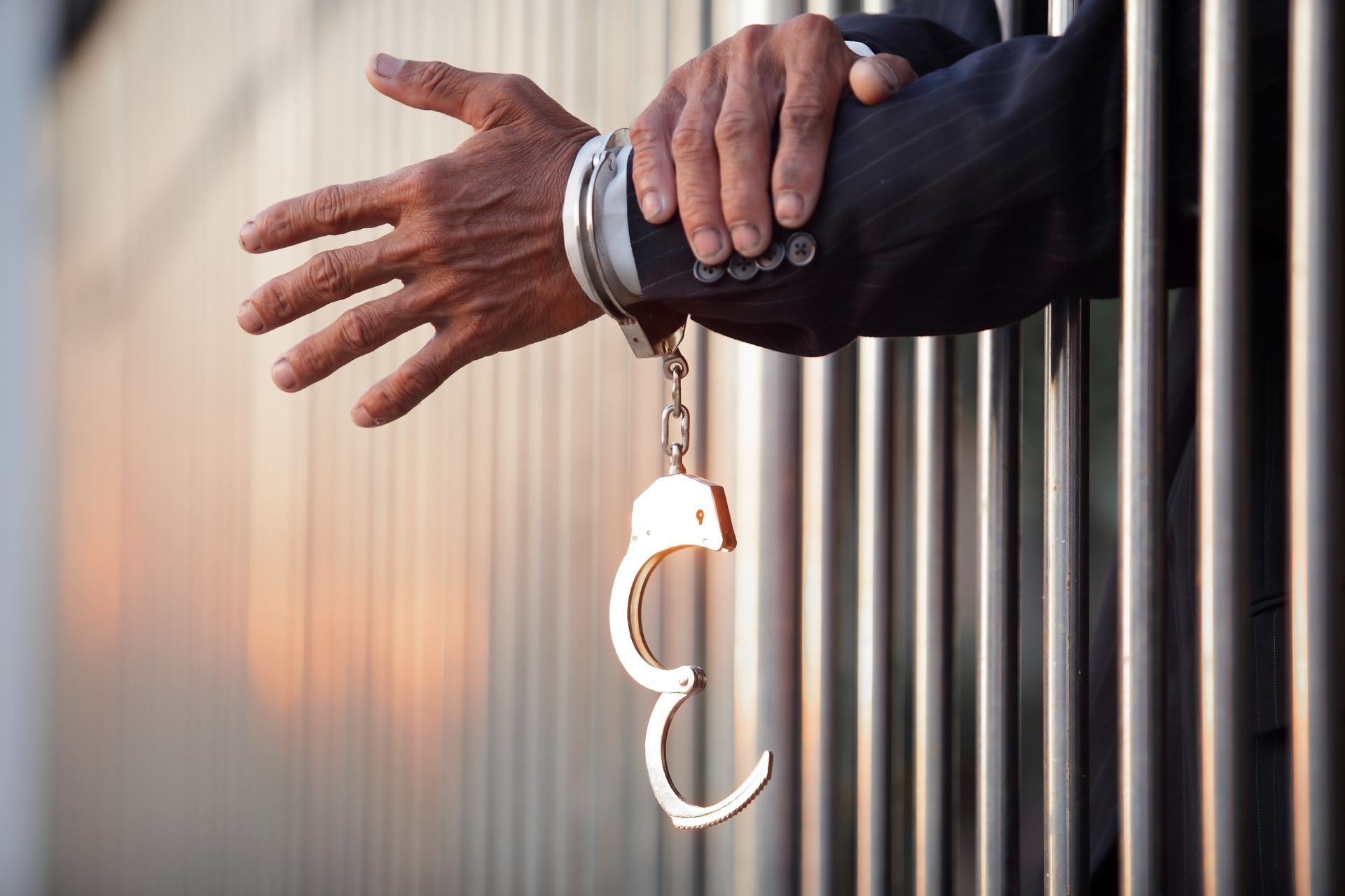 Man in jail handcuffed, urgent release needed; rely on trusted 24/7 Bail Bonds help