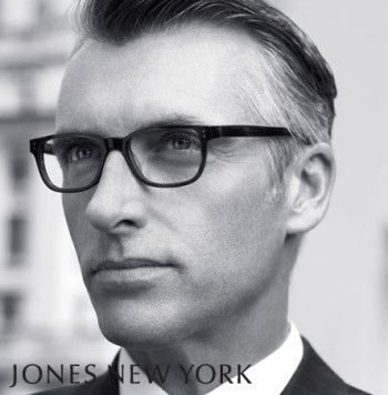 A black and white photo of a man wearing glasses by jones new york