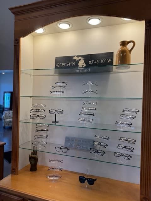 A display case with glasses and sunglasses on it