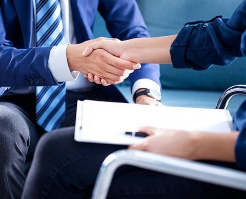 Commercial Specialist — Insurance Agent Shaking Hands With The Client in Corrales, NM