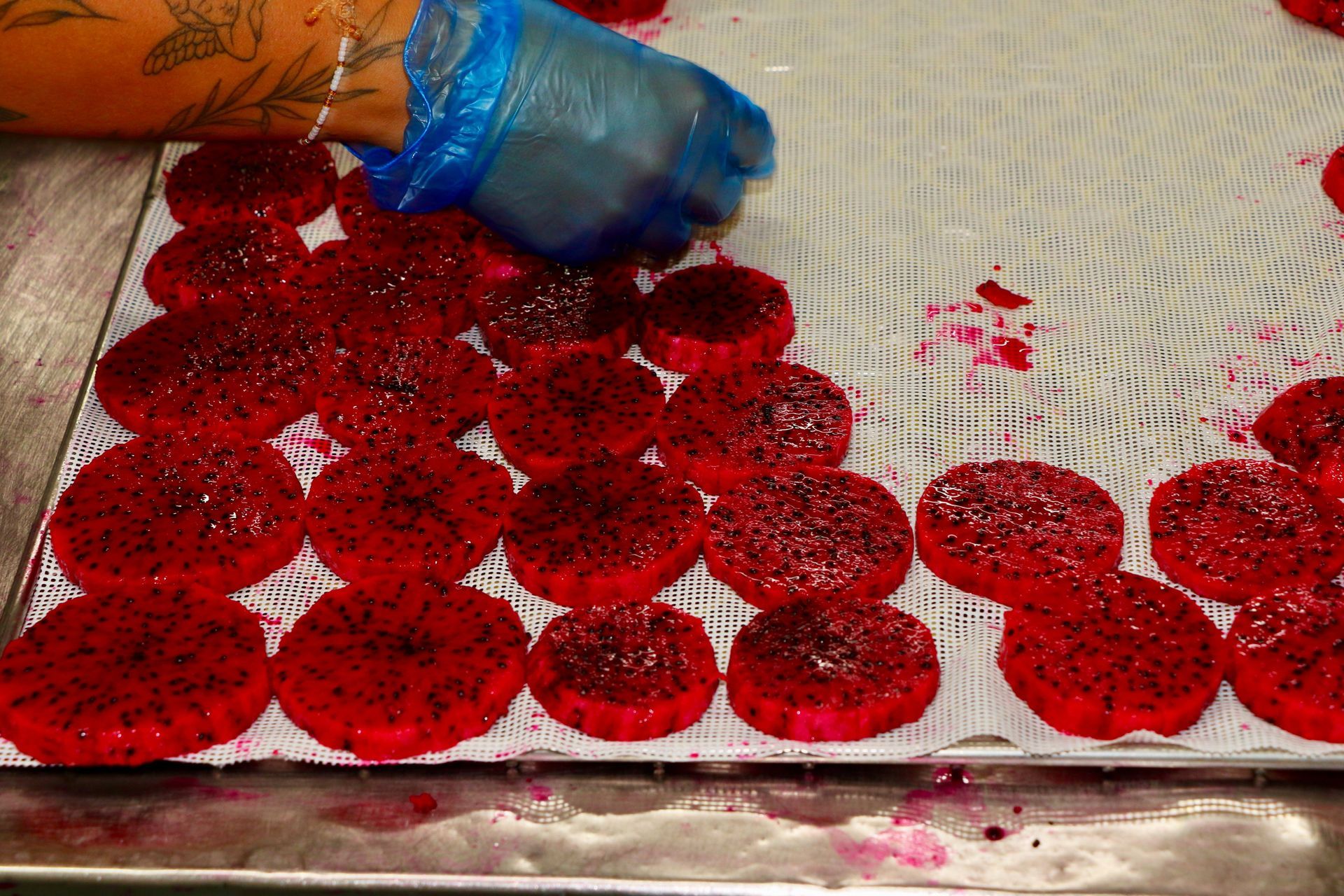 A Tray of Red Slices of Dragon Fruit on a Table — Mareeba Golden Dried Mangoes in Mareeba, QLD