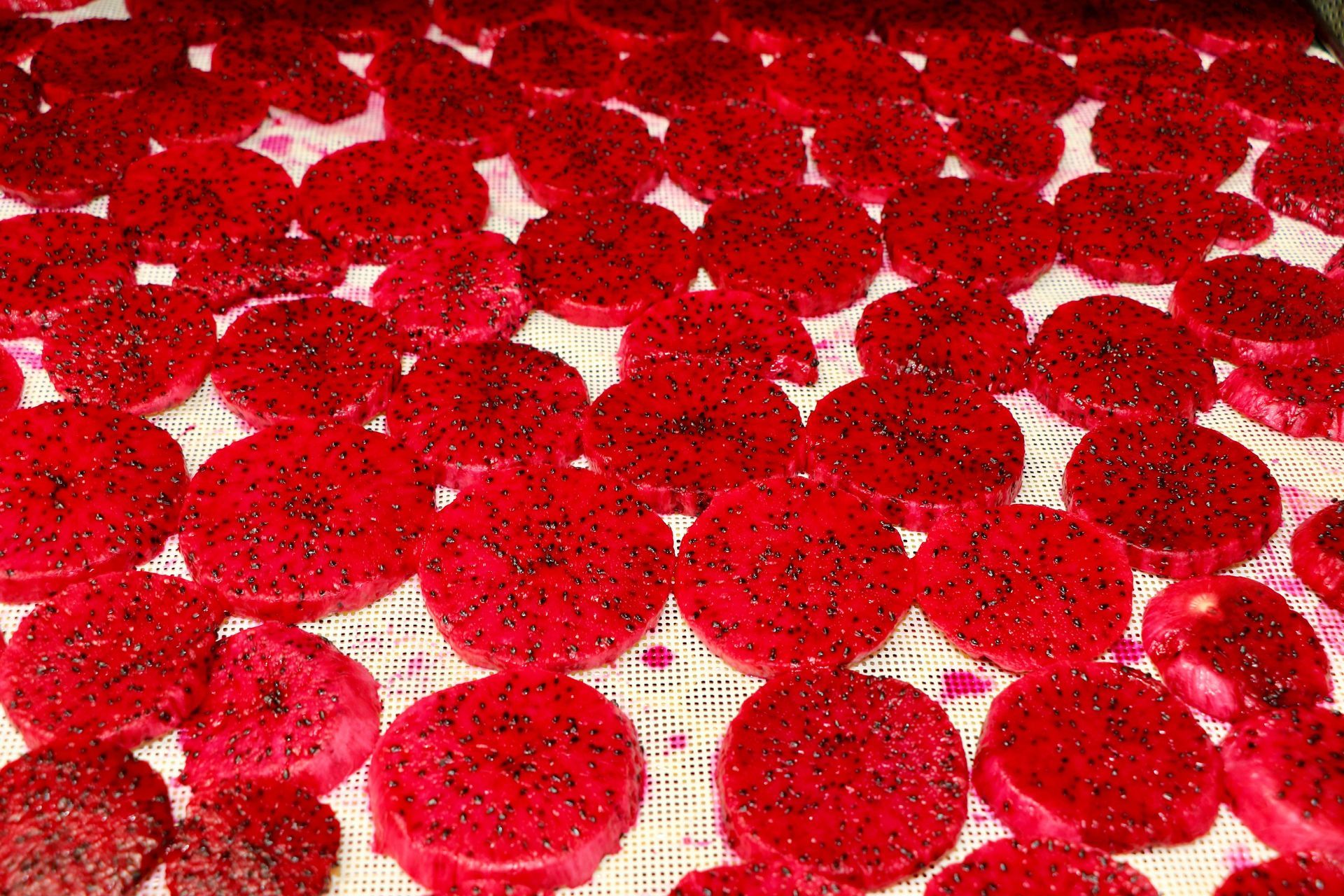 A Bunch of Red Circles Are Laying on a Table — Mareeba Golden Dried Mangoes in Mareeba, QLD