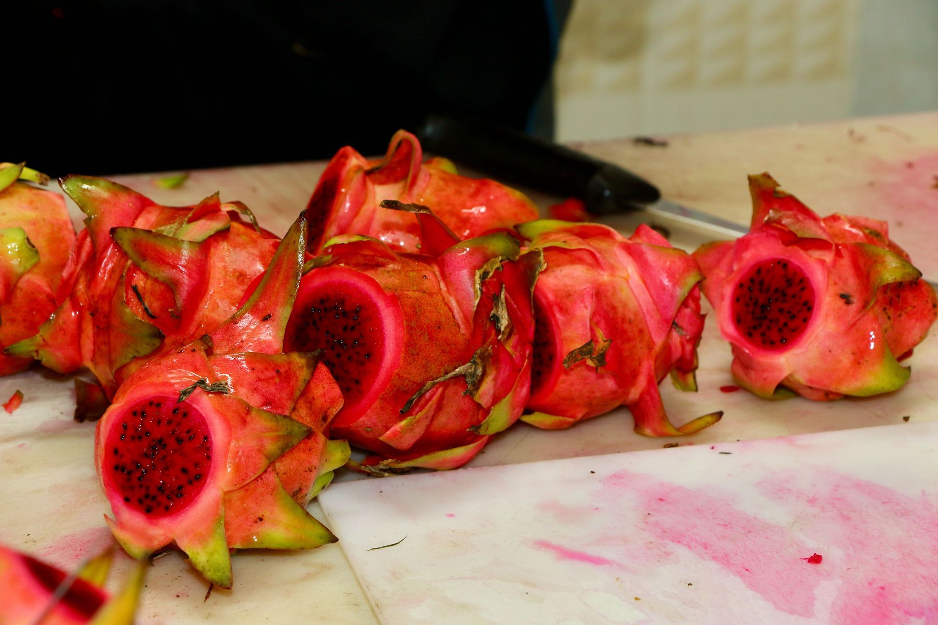 A Bunch of Dragon Fruits Are Sitting on a Cutting Board — Mareeba Golden Dried Mangoes in Mareeba, QLD