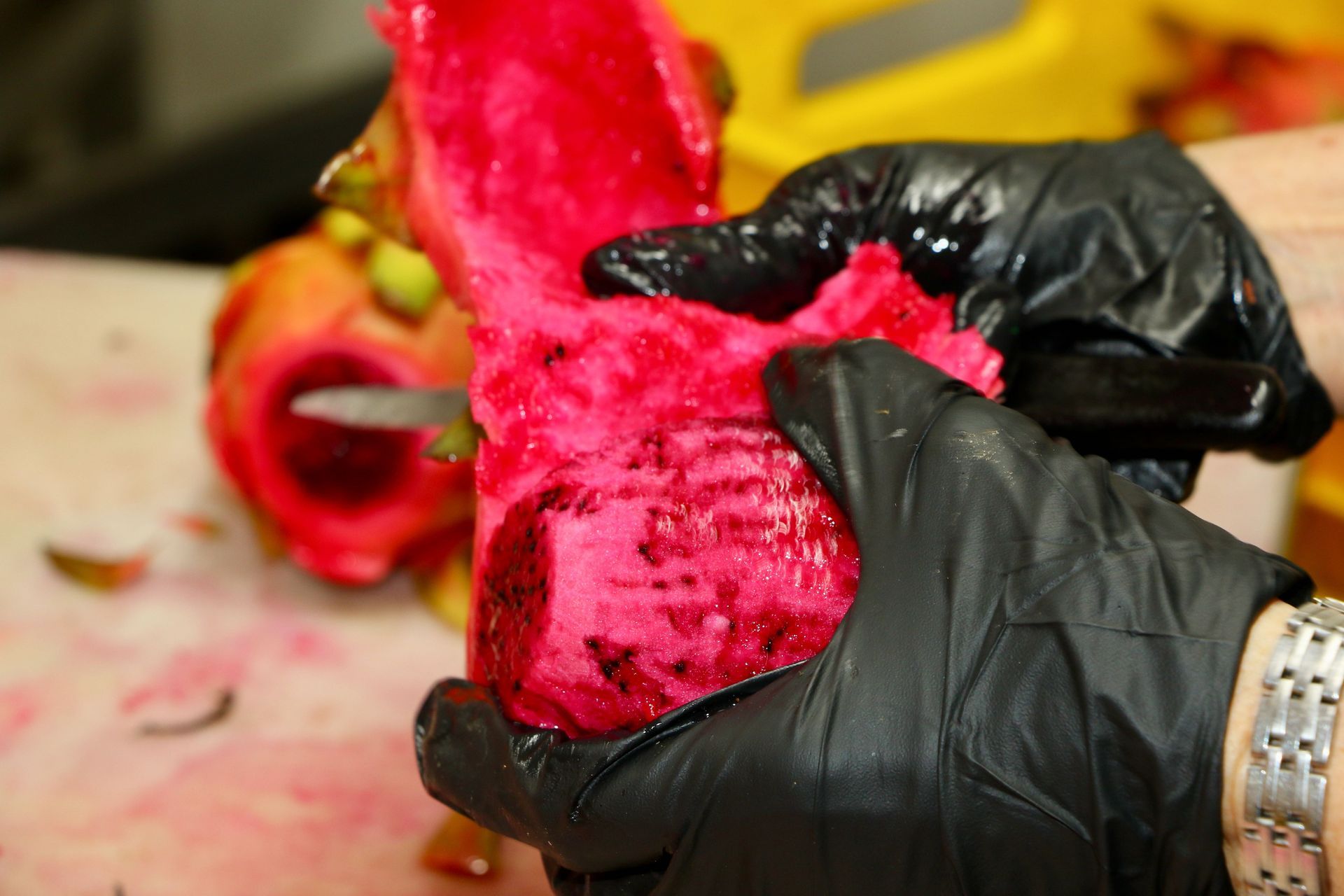 A Dragon Fruit is Being Sliced on a Cutting Machine — Mareeba Golden Dried Mangoes in Mareeba, QLD