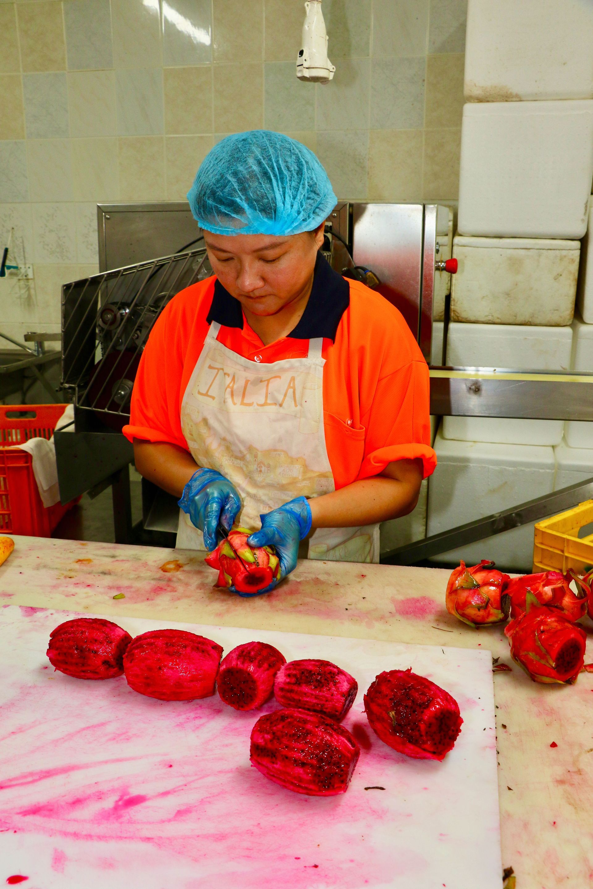 A Woman Wearing an Apron With the Word Fresh on It — Mareeba Golden Dried Mangoes in Mareeba, QLD