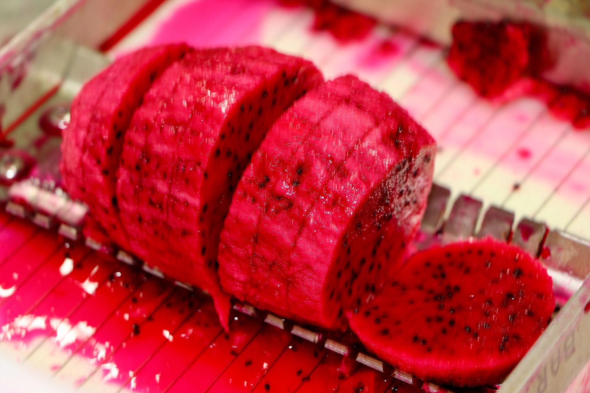 A Pile of Dried Banana Slices on a Plate Next to a Bag of Dried Banana Slices — Mareeba Golden Dried Mangoes in Mareeba, QLD