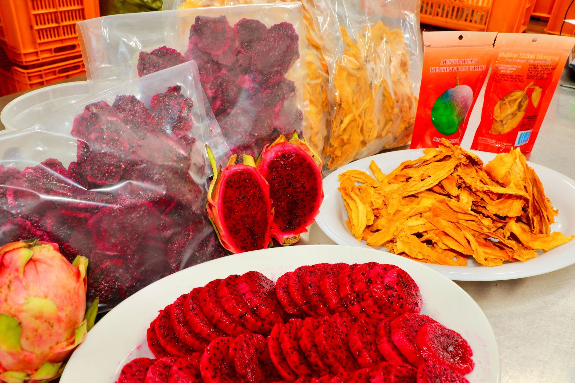 A Table Topped With Plates of Food and a Bag of Dried Fruit — Mareeba Golden Dried Mangoes in Mareeba, QLD