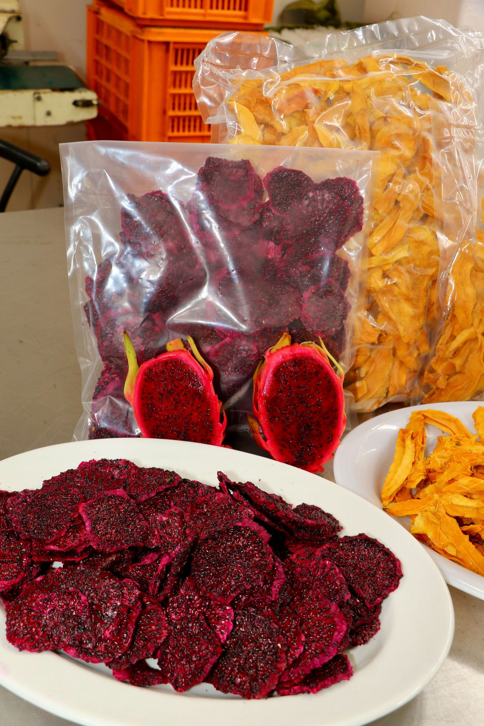 A Bag of Dried Fruit Next to a Plate of Dried Fruit — Mareeba Golden Dried Mangoes in Mareeba, QLD
