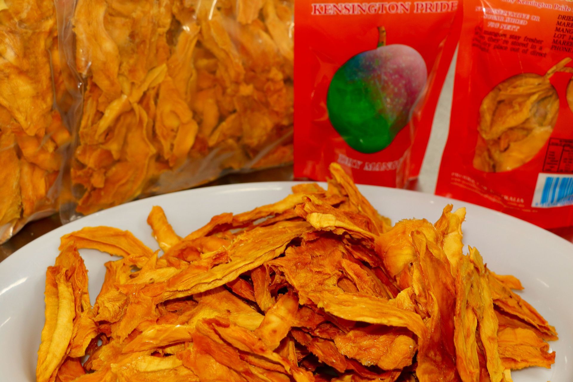 A Mango Slices Next to a Bag of Dried Mango Slices — Mareeba Golden Dried Mangoes in Mareeba, QLD