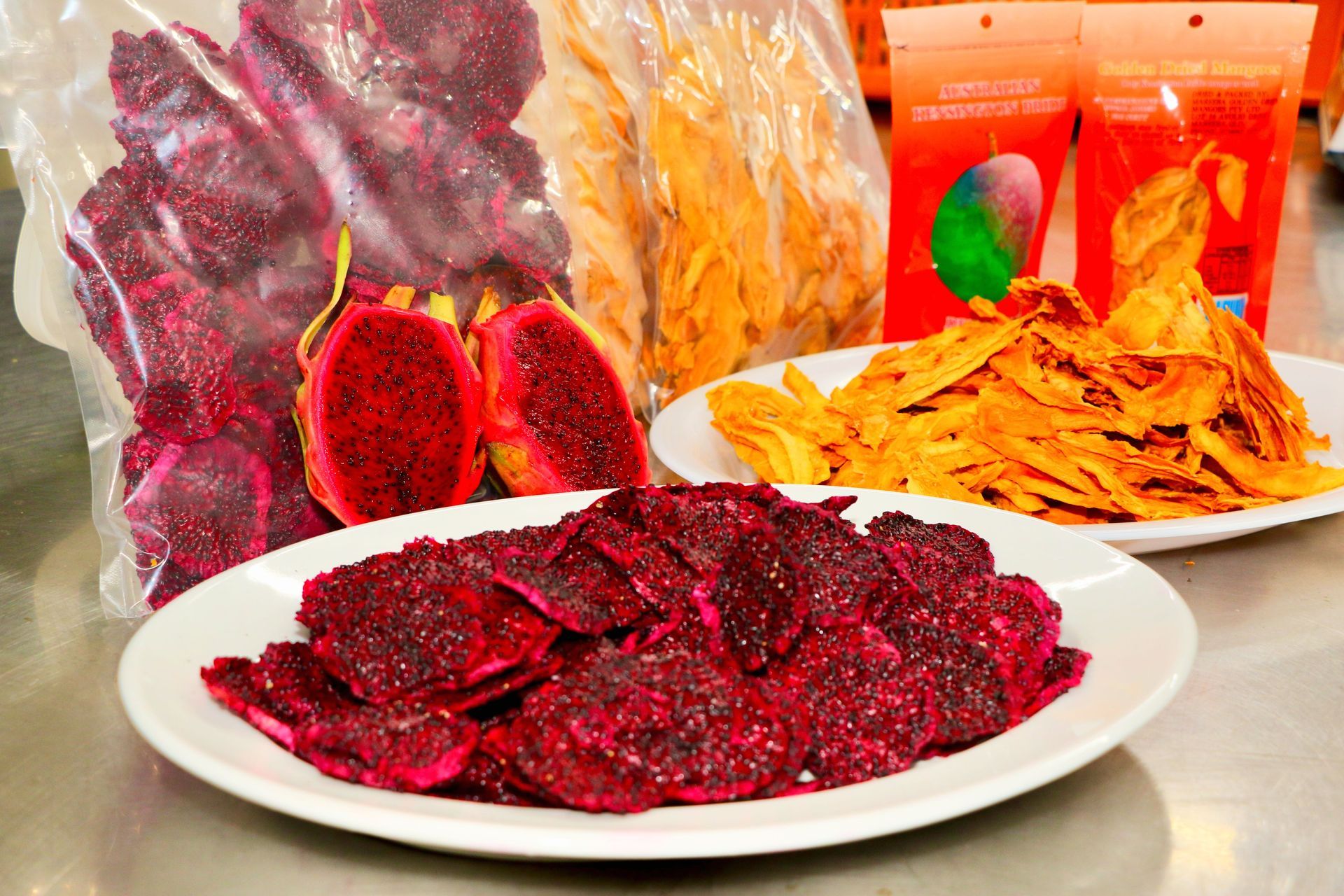 A Plate of Food With a Bag of Dried Fruit in the Background — Mareeba Golden Dried Mangoes in Mareeba, QLD