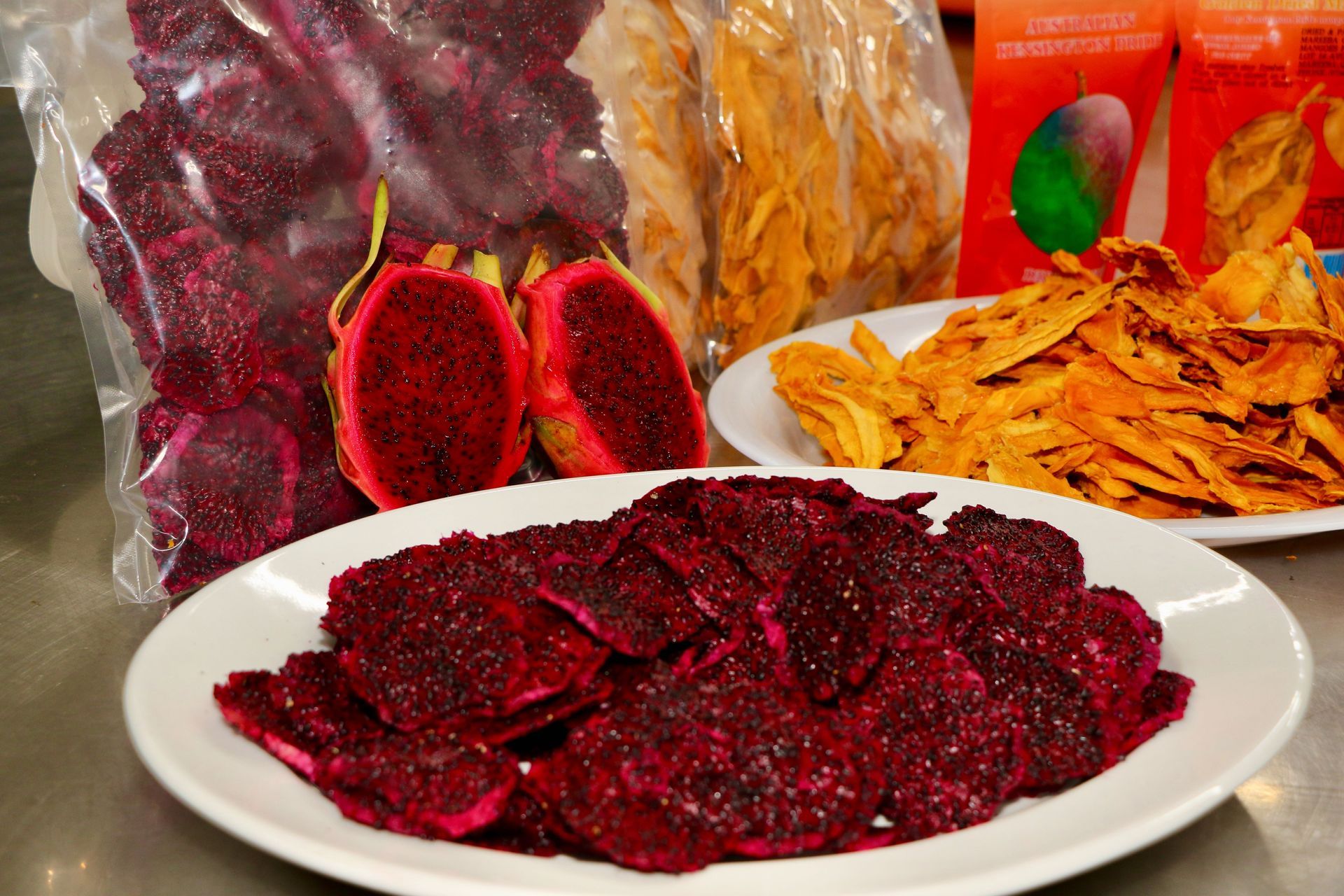 A Bag of Dried Fruit Next to a Plate of Dried Fruit — Mareeba Golden Dried Mangoes in Mareeba, QLD