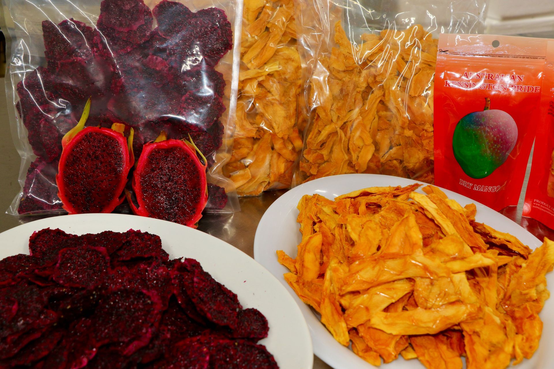 A White Plate Topped With French Fries Next to a Bag of French Fries — Mareeba Golden Dried Mangoes in Mareeba, QLD