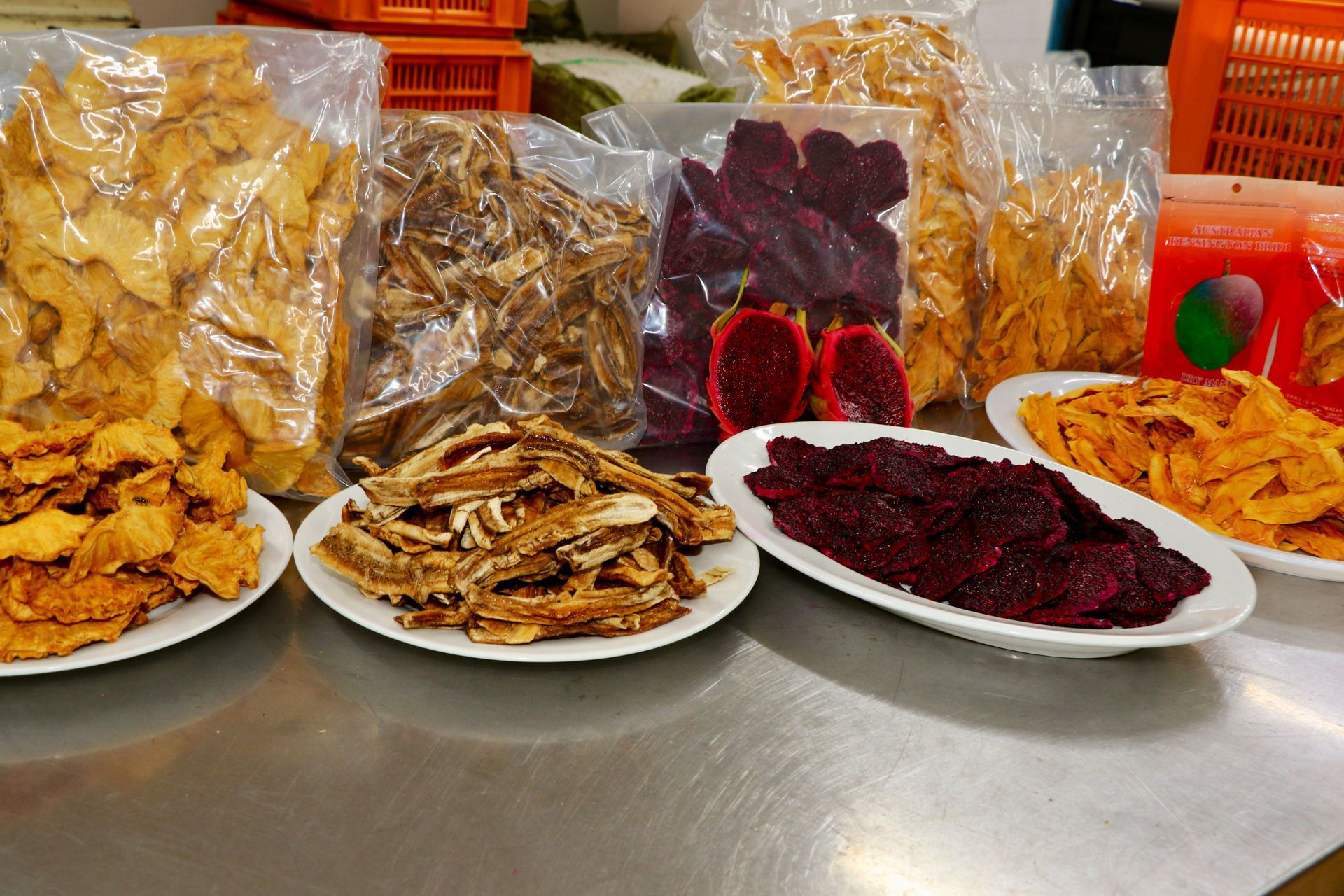 A Variety of Dried Fruits Are on Plates on a Table — Mareeba Golden Dried Mangoes in Mareeba, QLD