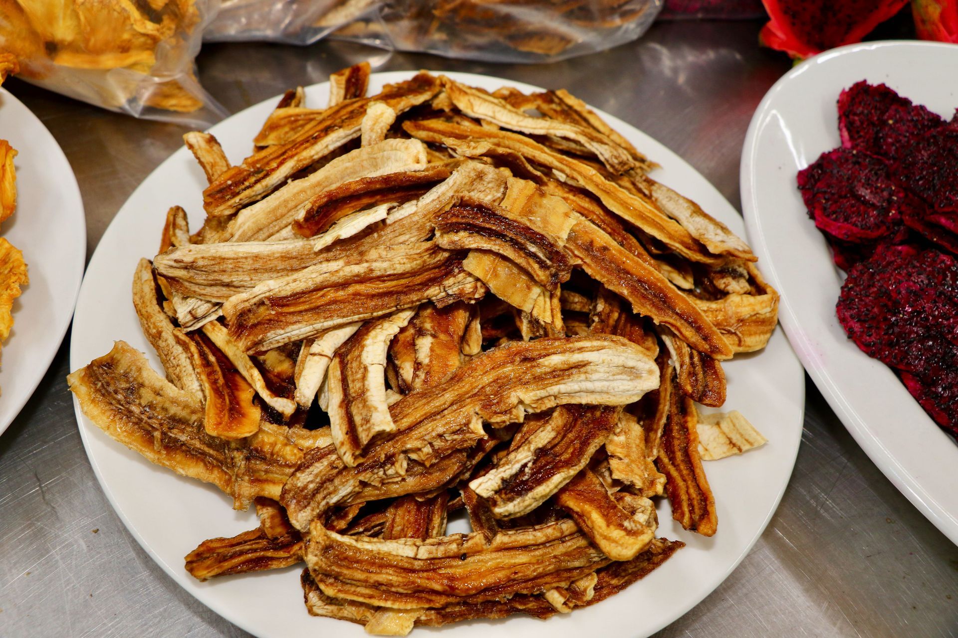 A Bunch of Bananas Are on The Plate Dried Out — Mareeba Golden Dried Mangoes in Mareeba, QLD