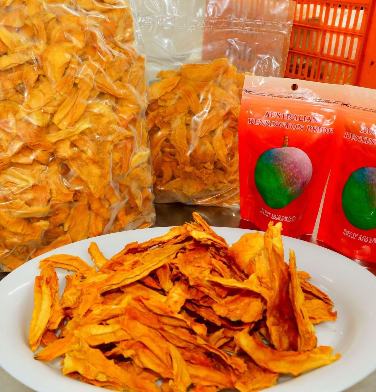 Dried Mango on a Plate and In Bags — Mareeba Golden Dried Mangoes in Mareeba, QLD