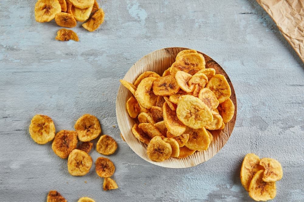 There is a Bowl of Banana Chips on the Table — Mareeba Golden Dried Mangoes in Gold Coast, QLD