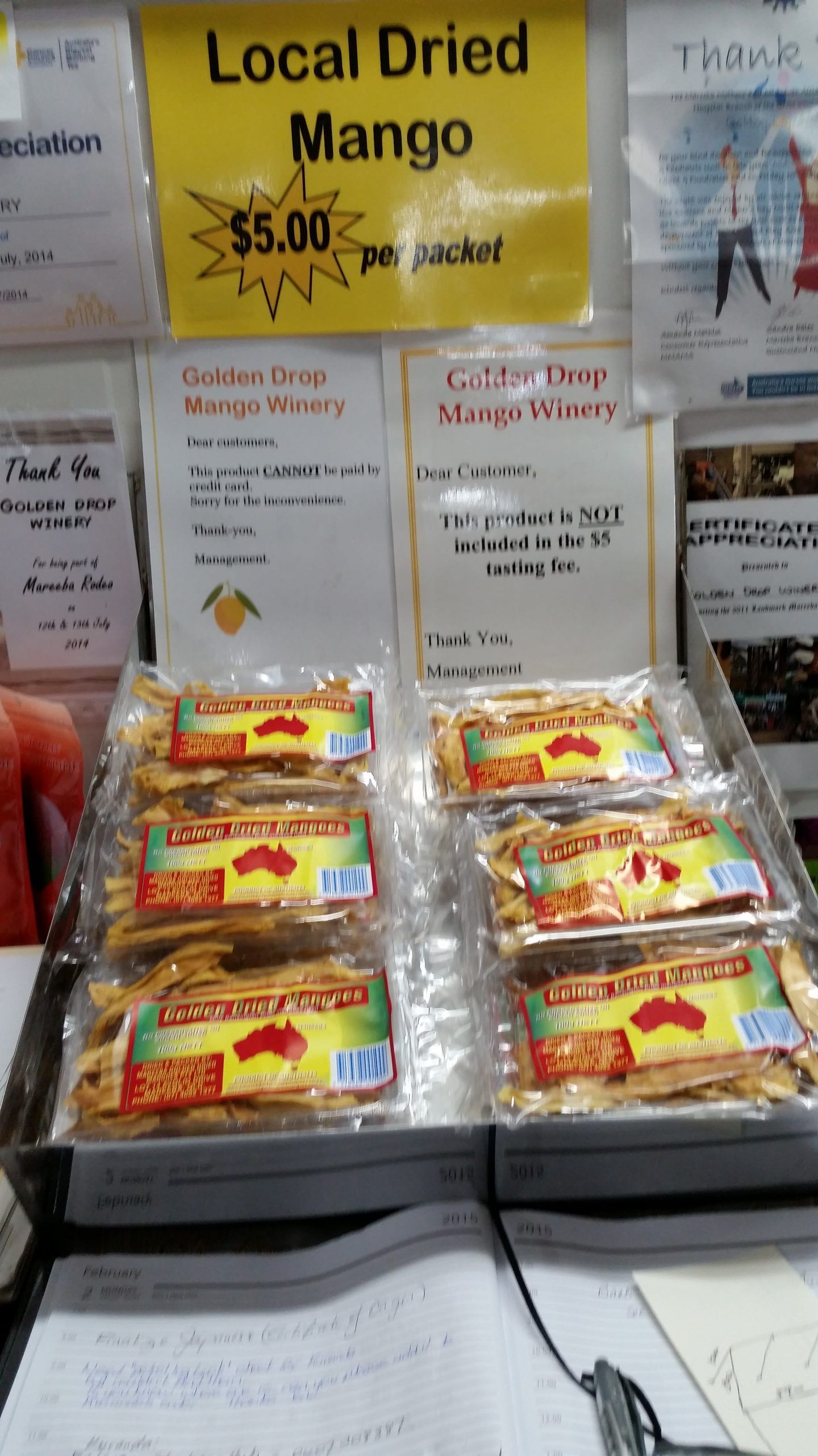 Two People Are Working on a Table in a Kitchen — Mareeba Golden Dried Mangoes in Mareeba, QLD