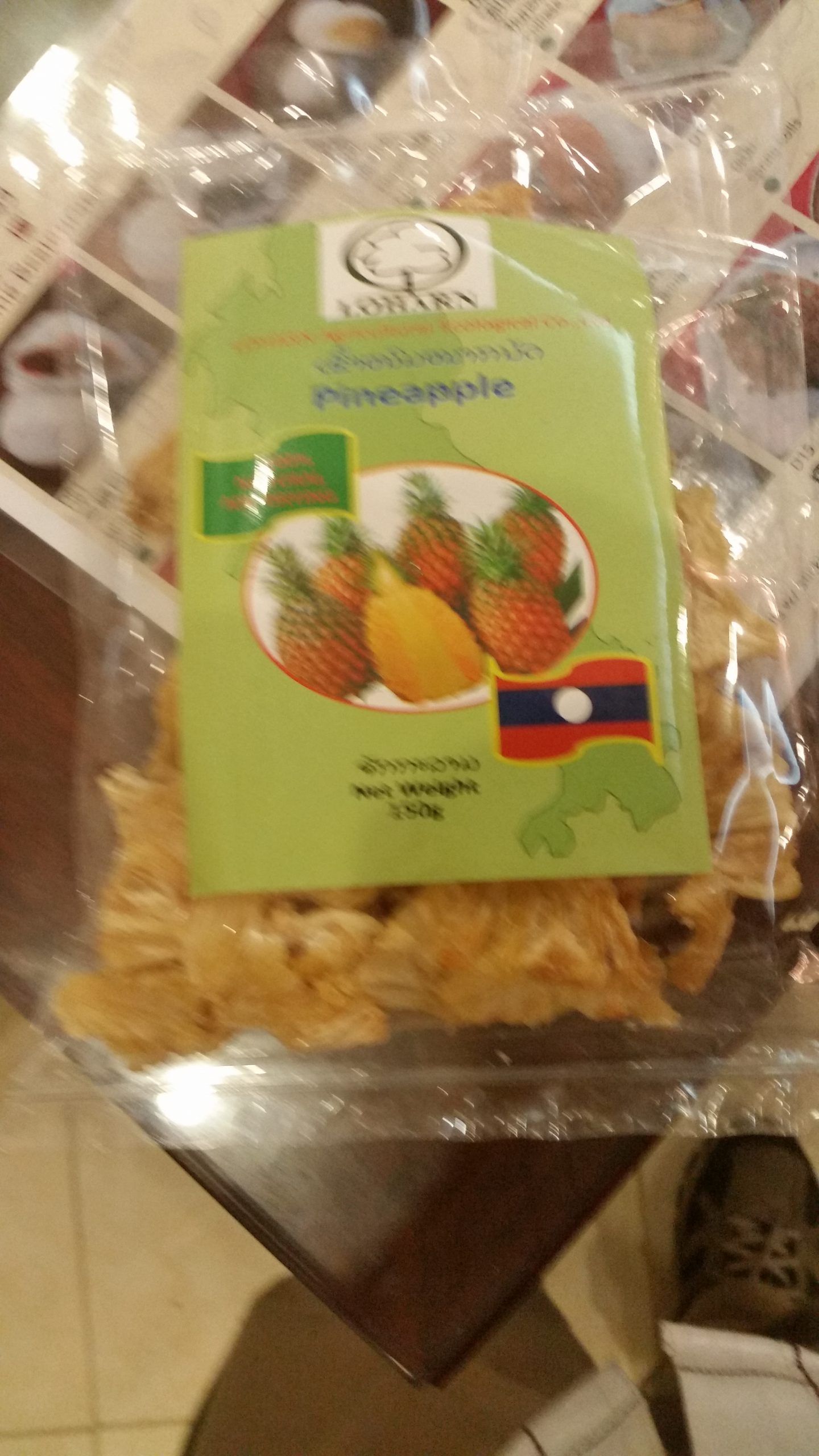 A Woman is Taking a Tray of Cookies Out of an Oven — Mareeba Golden Dried Mangoes in Mareeba, QLD