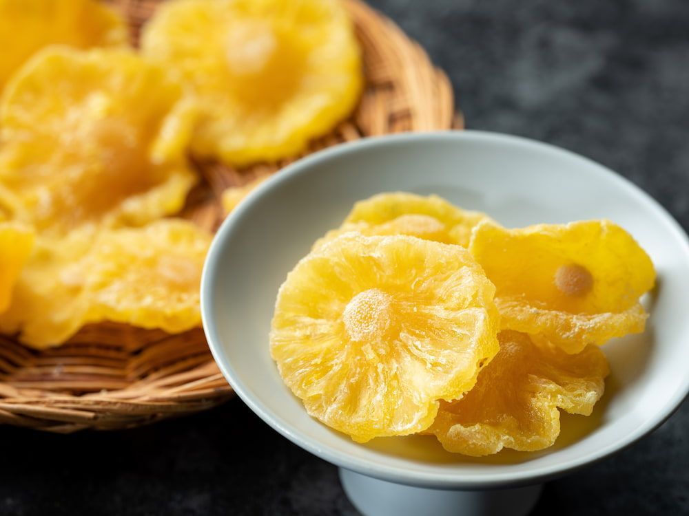 A Bowl of Dried Pineapple Slices — Mareeba Golden Dried Mangoes in Sunshine Coast, QLD