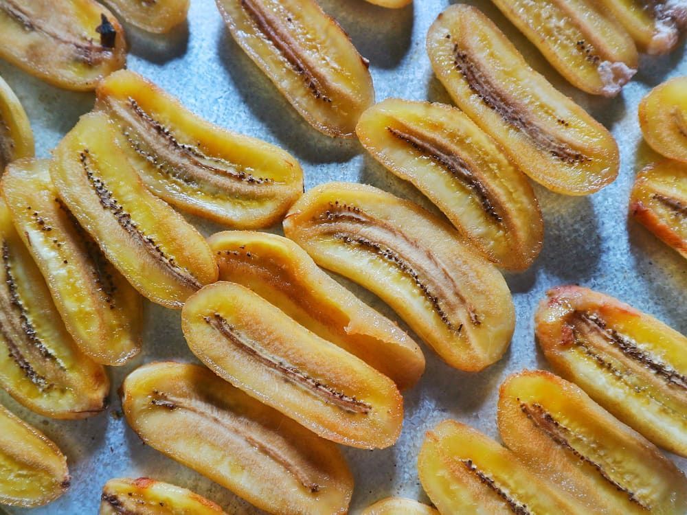 A Bunch of Dried Bananas Are Sitting on a Table — Mareeba Golden Dried Mangoes in Townsville, QLD