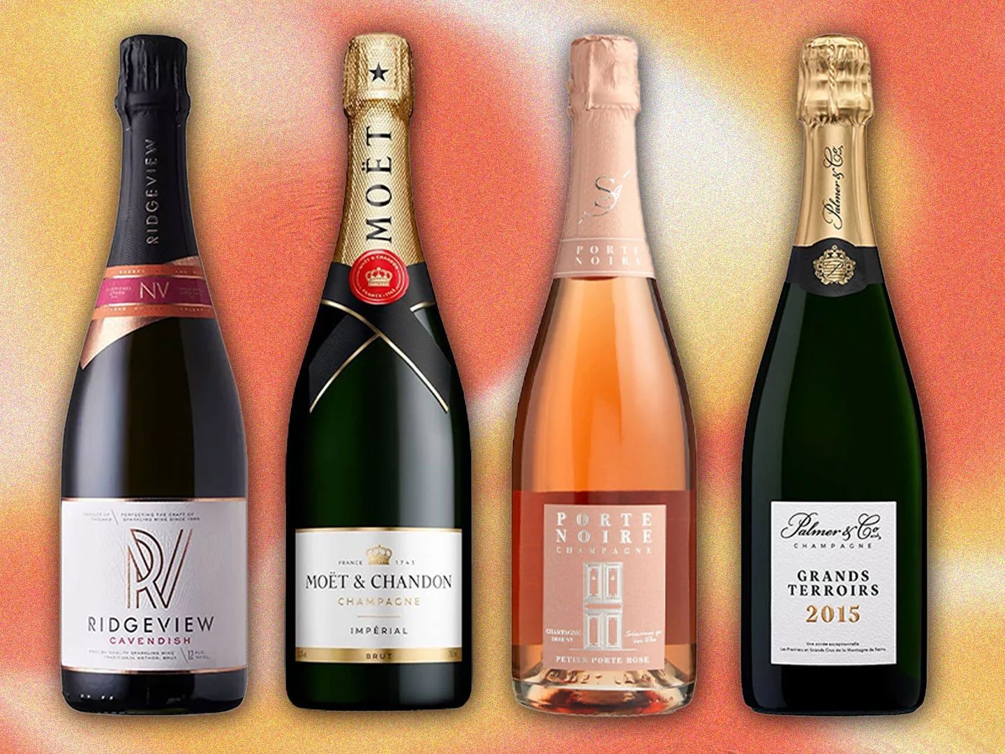 Four bottles of champagne are lined up in a row including moet