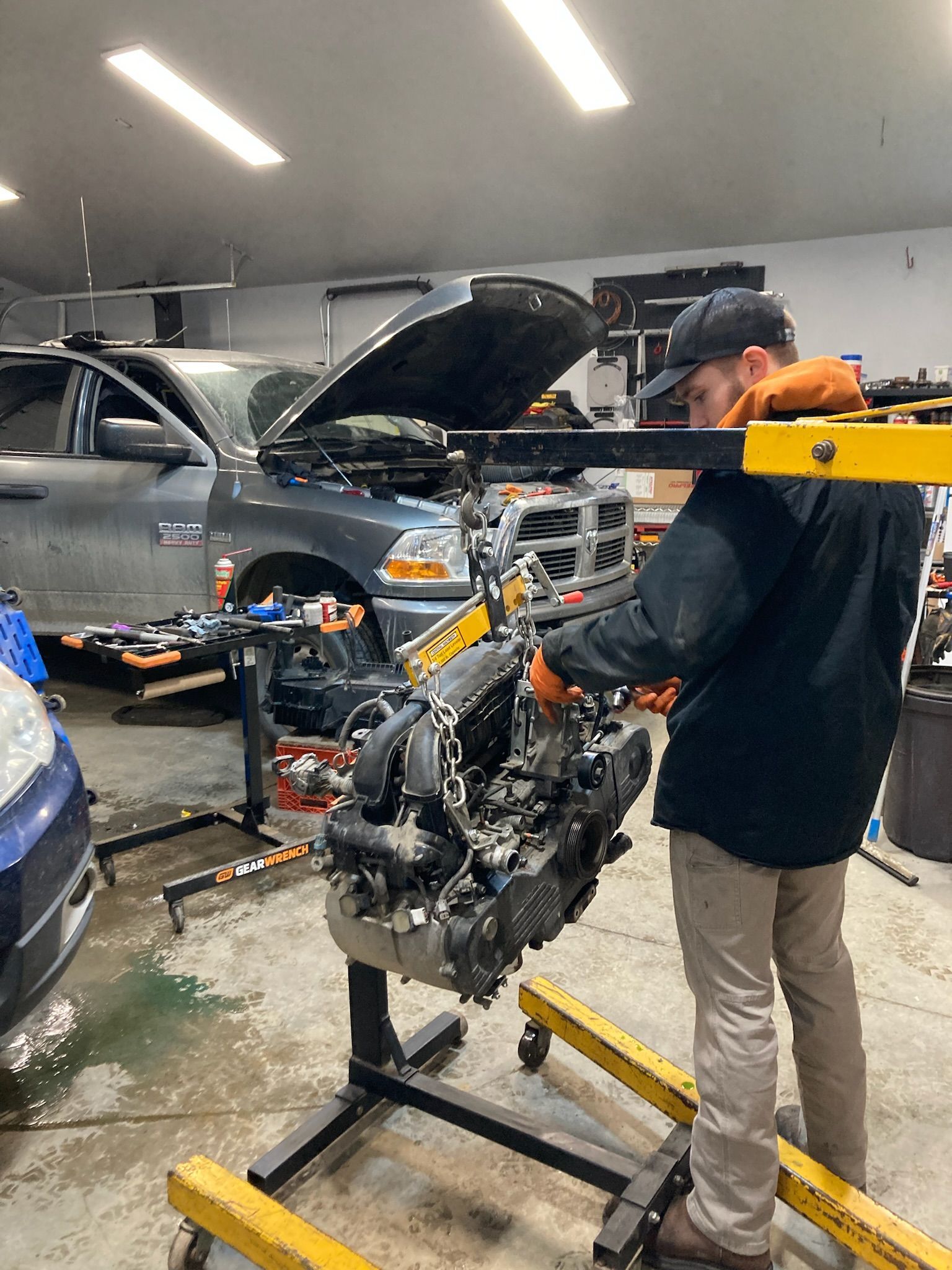 Auto Technician Performing Engine Work On Vehicle With Parts Removed | Hatch Peak Motorworks