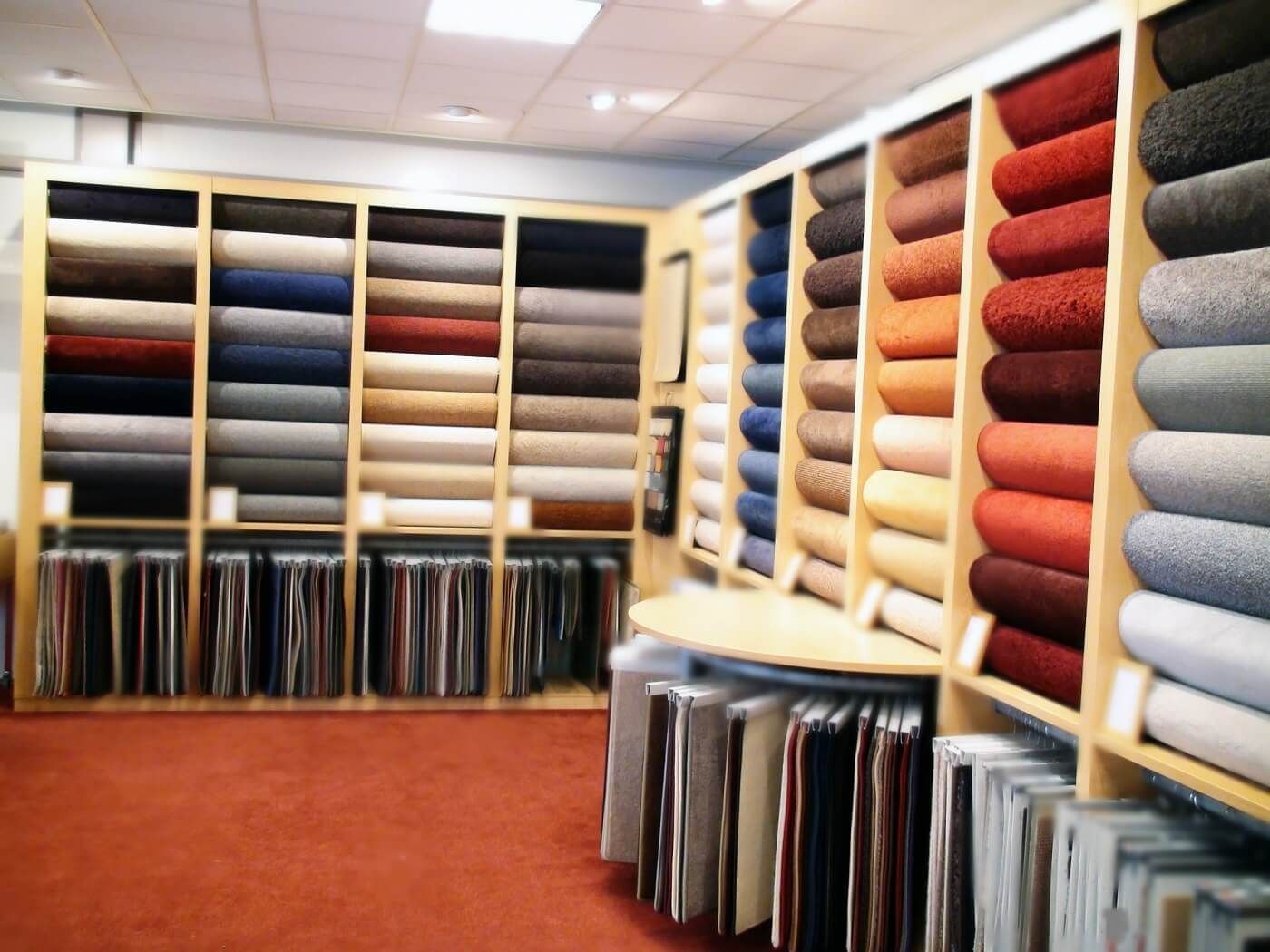 A store filled with lots of different colored fabrics.