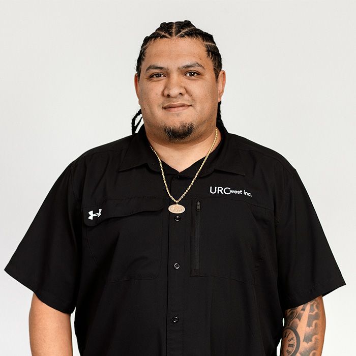 A man wearing a black shirt that says urc on it