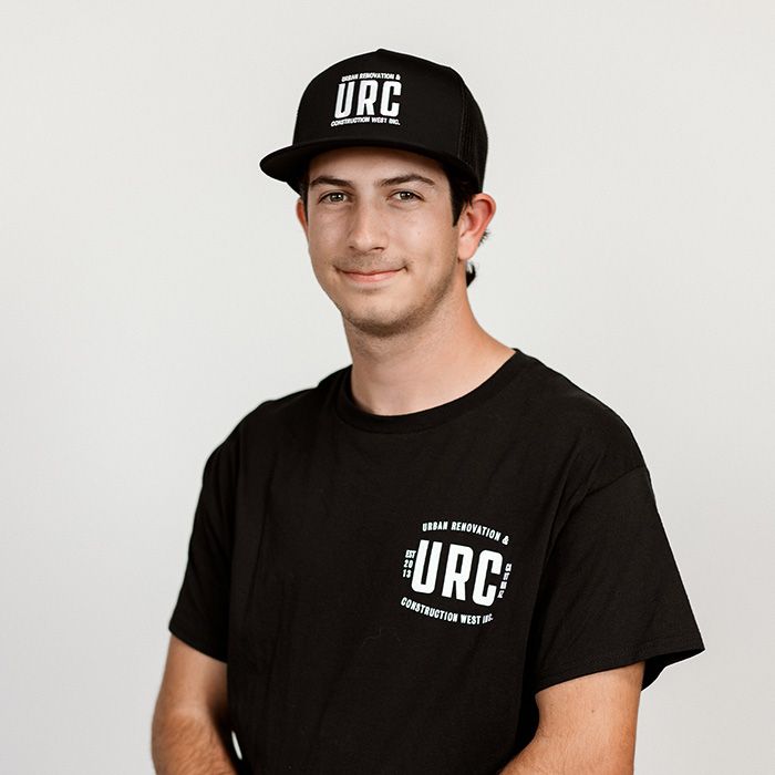 A man wearing a urc hat and a black shirt