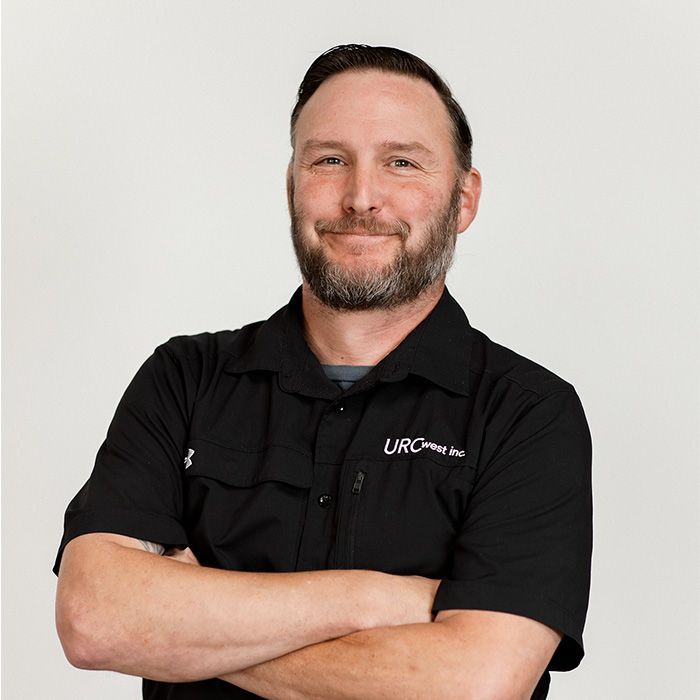 A man with a beard wearing a black shirt that says wrc on it