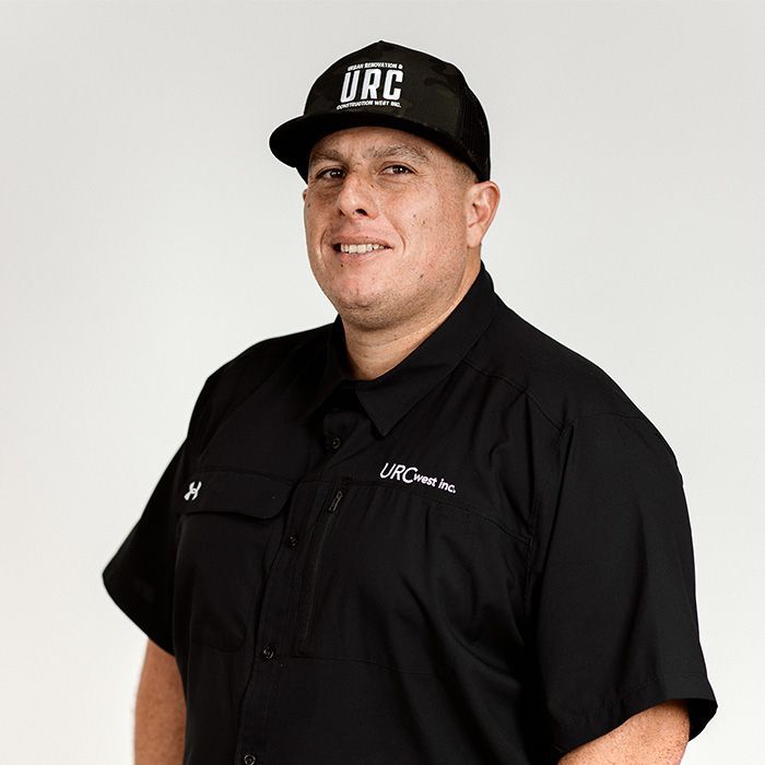 A man wearing a hat that says drc on it