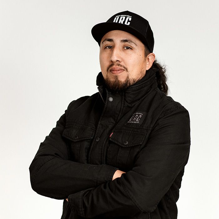 A man wearing a hat that says arc on it