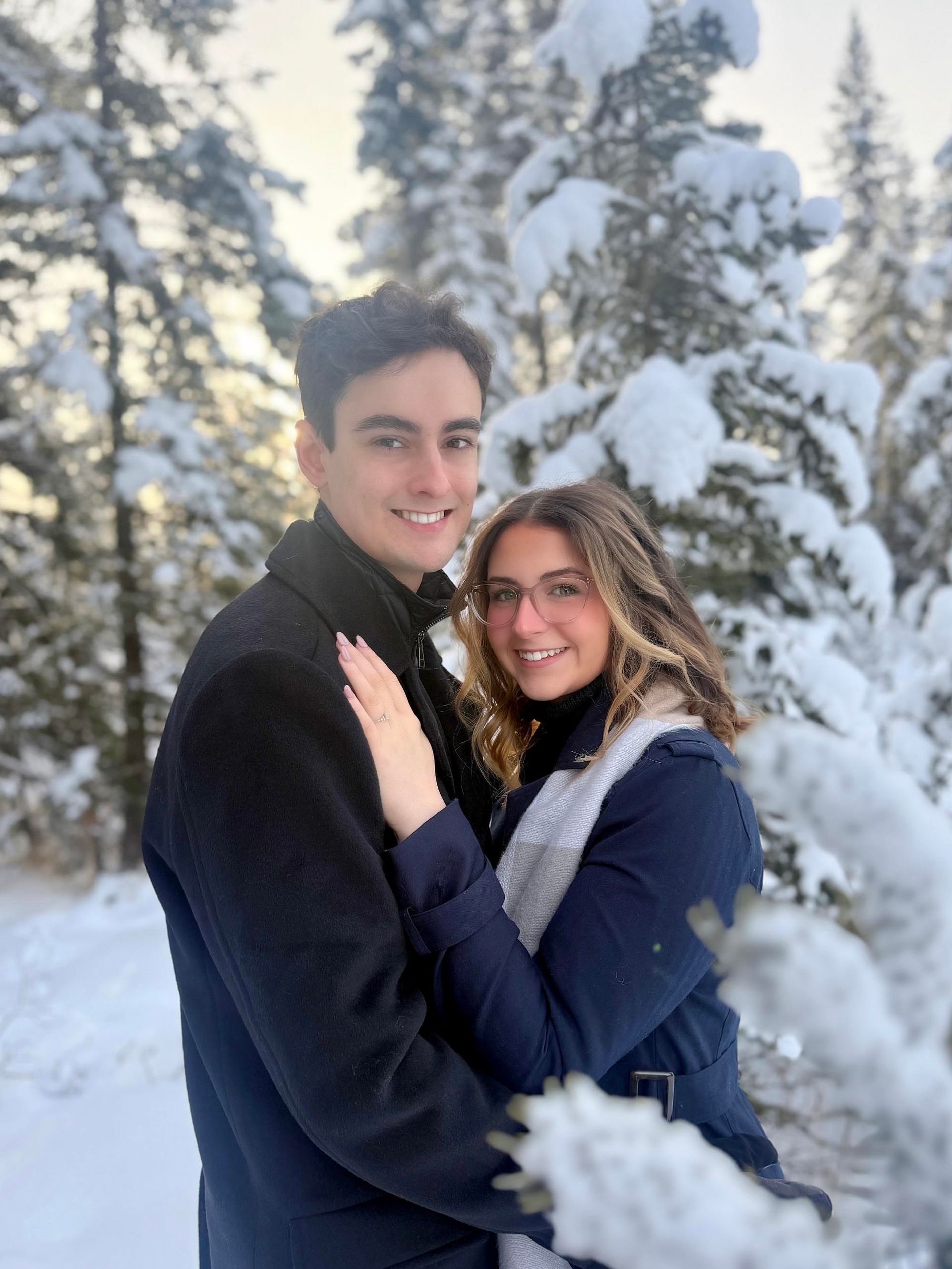 Travis and Emma in snowy forest