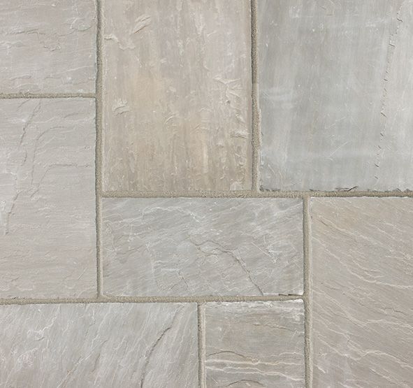 a close up of a gray tile floor .