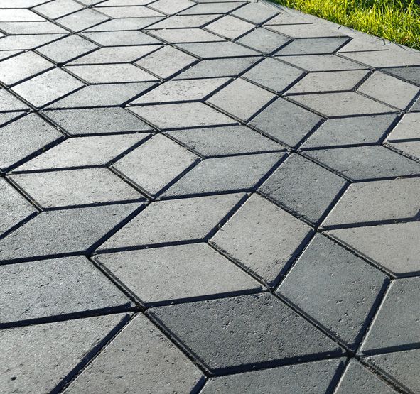 a brick walkway with a geometric pattern on it