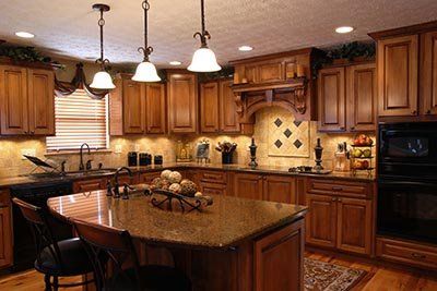 beautiful kitchen with island and wooden cabinets