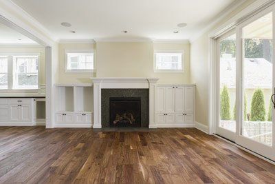 white fireplace and wooden floor